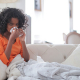 woman blowing nose