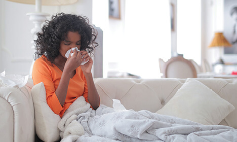 woman blowing nose