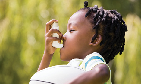 child with asthma inhaler
