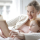 Mother and daughter reading indoors
