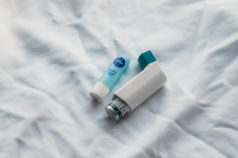 Chapstick next to an inhaler