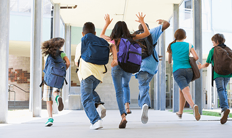 kids running into school