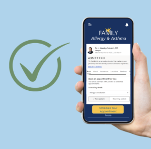 Green checkmark next to a hand holding an iphone with someone booking an appointment